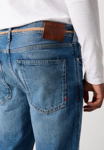 Клешеные джинсы