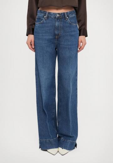 Клешеные джинсы