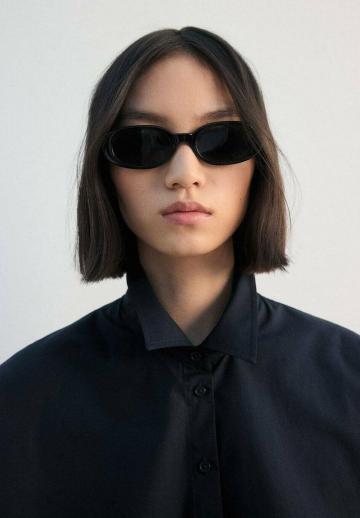 Блузка без рукавов