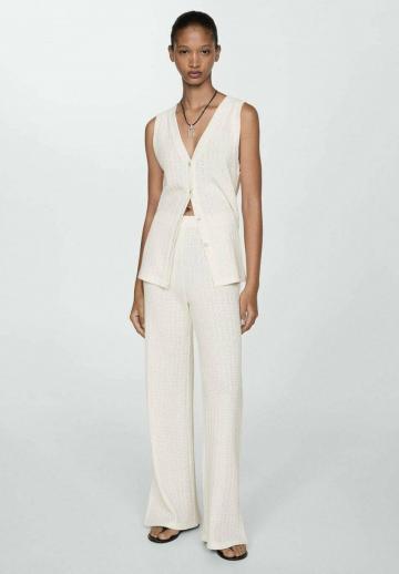 Длинный жилет