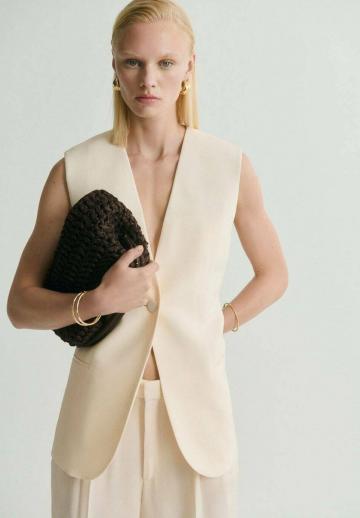 Длинный жилет