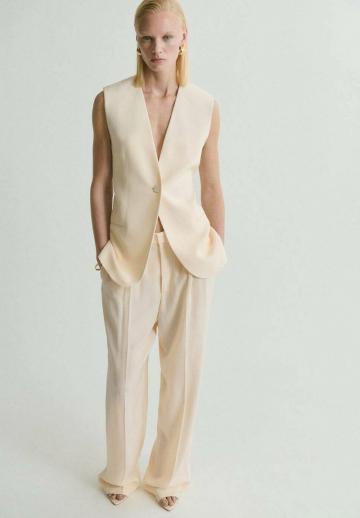 Длинный жилет