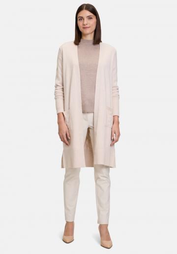 Длинный жилет