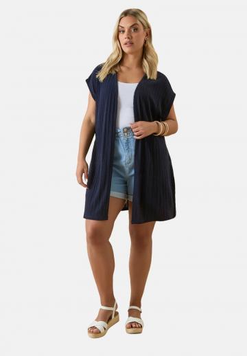 Длинный жилет