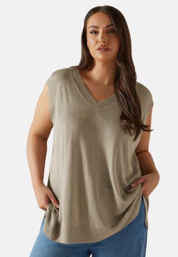 Длинный жилет