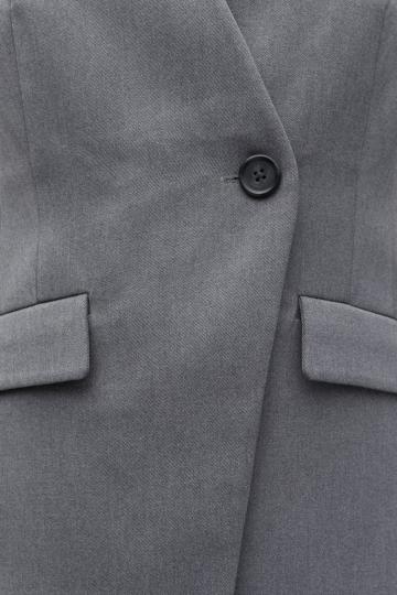 Длинный жилет