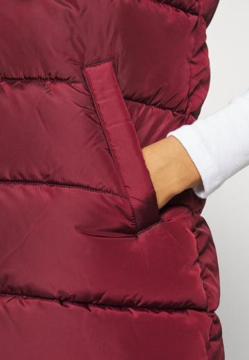 Длинный жилет