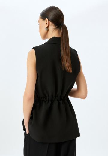 Длинный жилет