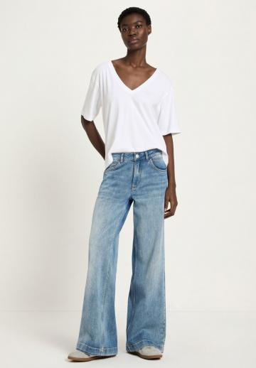 Клешеные джинсы