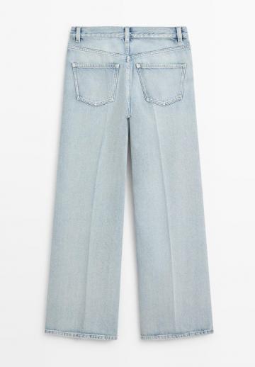 Клешеные джинсы