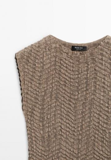 Блузка без рукавов