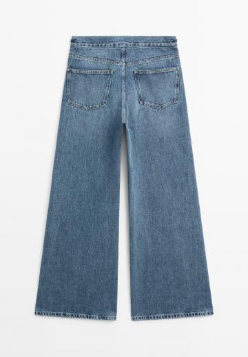 Клешеные джинсы