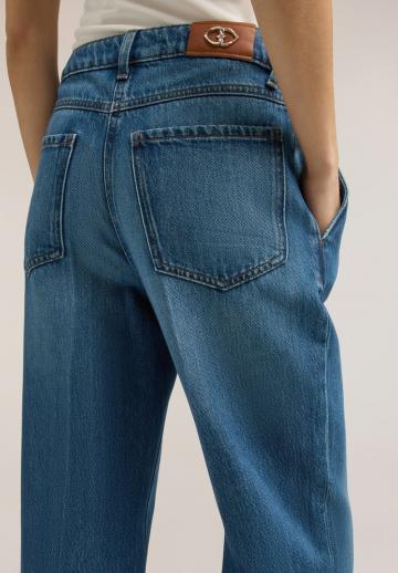 Клешеные джинсы
