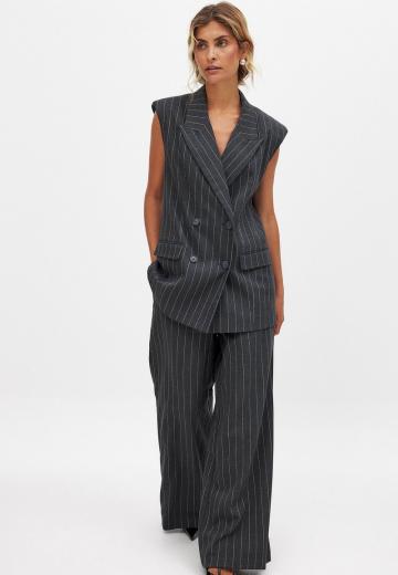 Длинный жилет