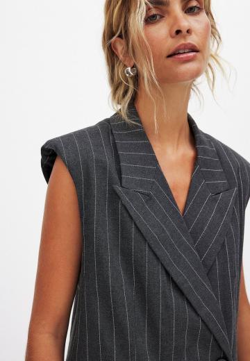 Длинный жилет