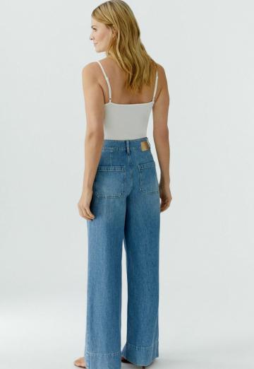 Клешеные джинсы