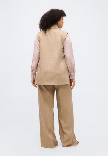 Длинный жилет