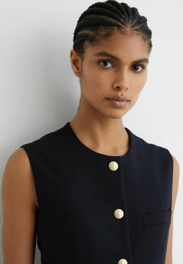 Длинный жилет