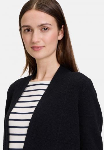 Длинный жилет