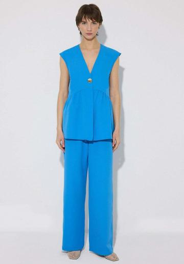 Длинный жилет