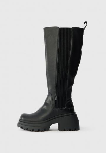 Высокие сапоги