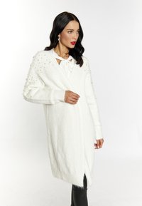 Длинный жилет