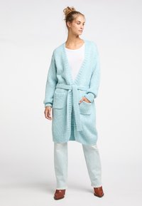 Длинный жилет