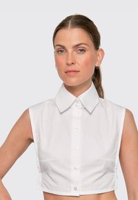 Блузка без рукавов Блузка без рукавов