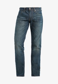 Клешеные джинсы Клешеные джинсы