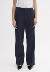 Клешеные джинсы