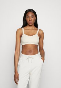 Спортивный бюстгальтер Спортивный бюстгальтер