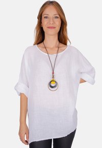 Длинная блузка