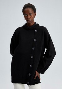 Длинный пуловер