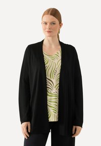 Длинный жилет