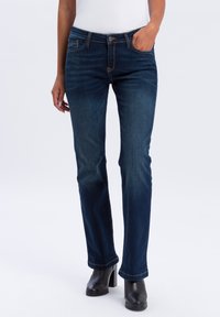 Клешеные брюки