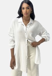 Длинная блузка