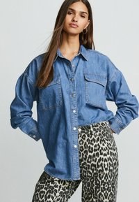 Джинсовая жилетка