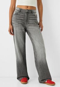 Клешеные джинсы