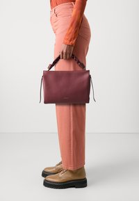 Кожаная сумка