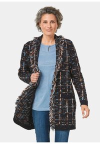 Длинный жилет