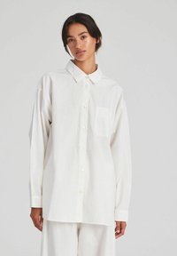 Длинная блузка