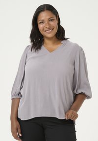 Длинная блузка