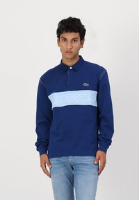 Поло с длинным рукавом Поло с длинным рукавом