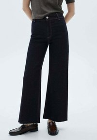 Клешеные джинсы Клешеные джинсы