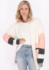 Длинный жилет