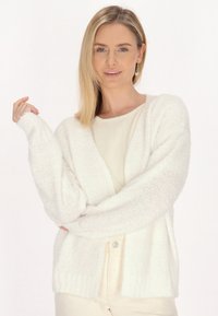 Длинный жилет