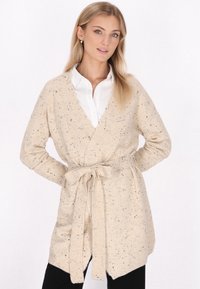 Длинный жилет