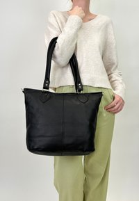 Кожаная сумка