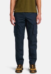 Брюки с накладными карманами Брюки с накладными карманами