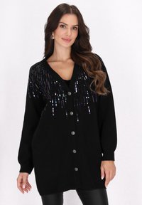 Длинный жилет